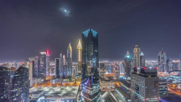 Panorama of futuristic skyscrapers in financial district business center in Dubai all night timelapse — Stock Video