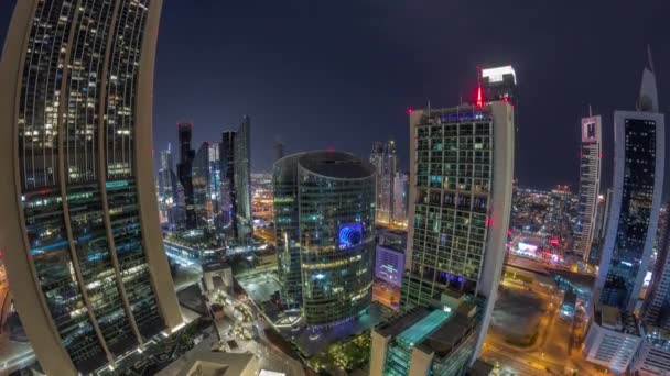 Dubai centro financiero internacional rascacielos aéreos toda la noche timelapse panorámica. — Vídeo de stock