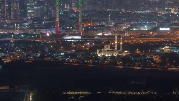 Skyline of the Dubai stad med moderna skyskrapor i Deira och Zabeel distrikt antenn natt timelapse — Stockvideo