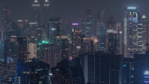 Dubai iş sahası kulelerinin modern mimarisine sahip Skyline gece zaman çizelgesi. Hava görünümü — Stok video