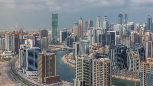 Skyline with modern architecture of Dubai business bay towers timelapse. Aerial view — Stock Video