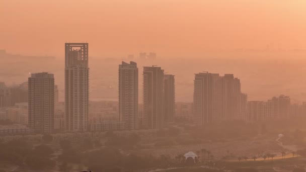 Greens and al barsha heights district area night to day timelapse from Dubai marina. — Stock Video