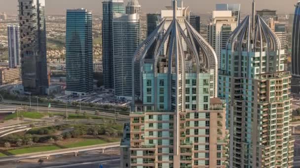 Dubai marina and JLT skyscrapers over Sheikh Zayed Road air timelapse. — стокове відео