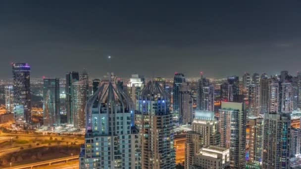 Dubai marina and JLT skyscrapers along Sheikh Zayed Road aerial night timelapse. — Stock Video