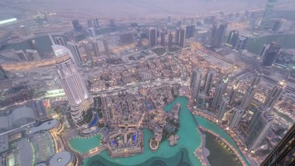 Dubai downtown from day to night transition with city lights from Burj Khalifa timelapse — Stock Video