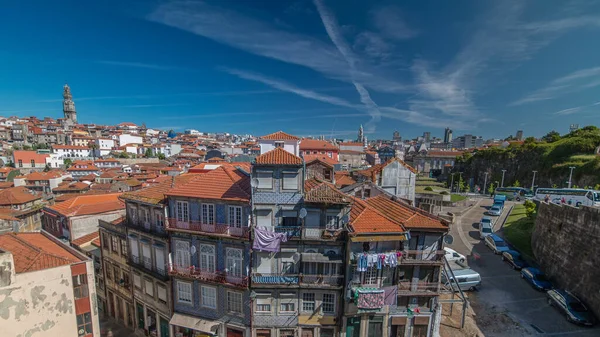 Panorama showing overview of old town of Porto timelapse with houses rooftops from Centro Portugues de Fotografia to City Hall building, Portugal