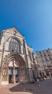 Eglise Saint-Pierre Church of St. Peter timelapse hyperlapse. A Medieval church situated in the heart of Old Bordeaux at Place Saint-Pierre. Front view with entrance. France