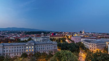 Panorama of the city center day to night transition timelapse shoot from top of the skyscraper with aerial view to intersection in front of national theater and museum in Zagreb, Croatia after sunset