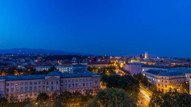 Panorama of the city center day to night transition timelapse shoot from top of the skyscraper with aerial view to intersection in front of national theater and museum in Zagreb, Croatia after sunset