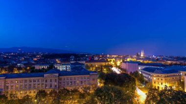 Panorama of the city center day to night transition timelapse shoot from top of the skyscraper with aerial view to intersection in front of national theater and museum in Zagreb, Croatia after sunset