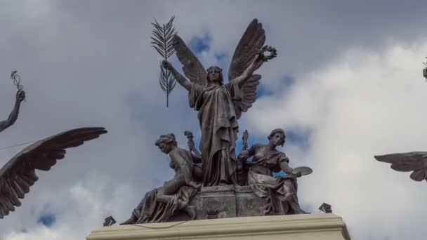 Statue on the top of beautiful government palace facade the Ministry of Agriculture building timelapse hyperlapse is placed close to the Atocha railway station in Madrid, Spain. — Stock Video