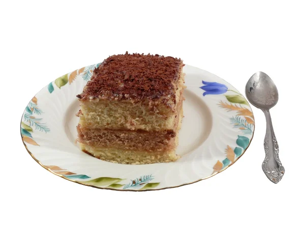 Bir çay kaşığı bir plaka üzerinde bir turta