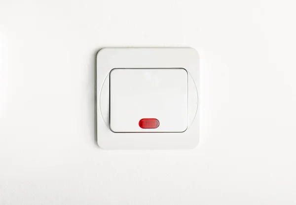 White light switch on/off on white wall with red led — Stock Photo, Image