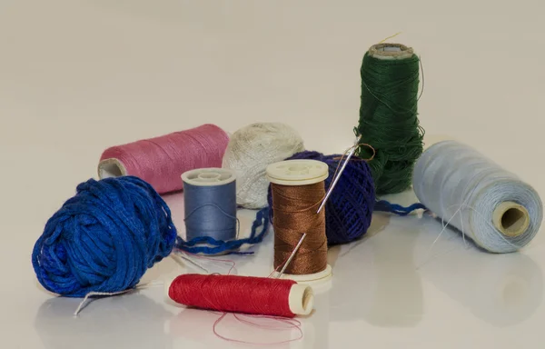 Needle and coat and cotton thread — Stock Photo, Image