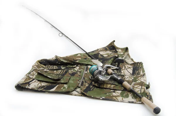 Rod with reel on camouflage fishing jacket — Stock Photo, Image