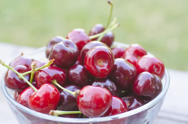 Cherries in transparent bowl — Stock Photo, Image