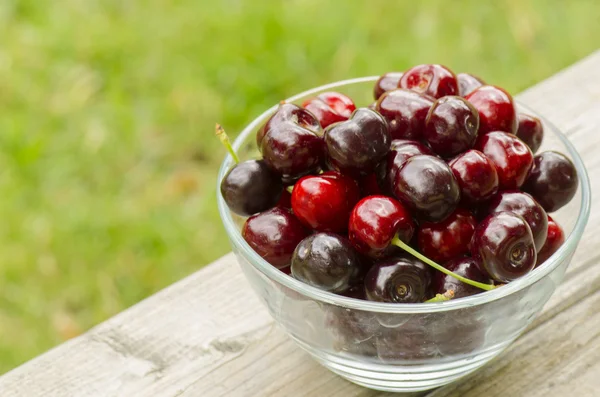 Red cherries in bowl — Stock Photo, Image