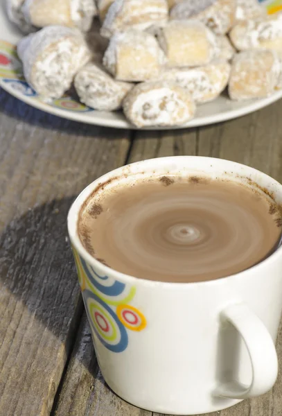 Hot chocolate in white mug with crescent rolls stuffed with waln — Stock Photo, Image