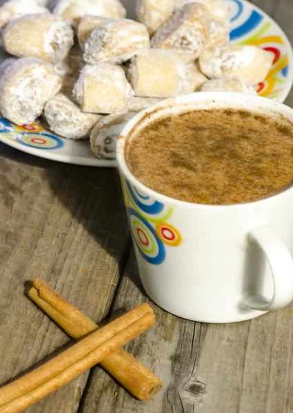 Hot chocolate with cinnamon and crescent rolls stuffed with waln — Stock Photo, Image