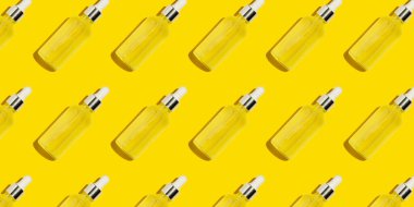 Sarı arka planda serum şişesi deseni