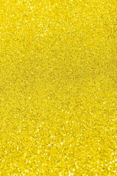 Belysande gul suddig glitter ljus bakgrund — Stockfoto