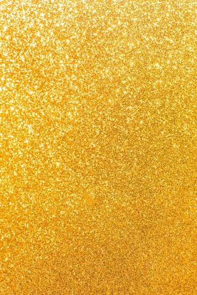 Abstract golden yellow and orange glitter lights background. Circle blurred bokeh. Festive vertical backdrop for Christmas, holiday or event