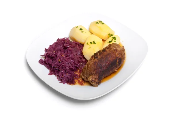 Roulade, Rotkohl und Kartoffeln lizenzfreie Stockbilder