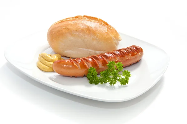 Saucisse grillée - Bratwurst à la moutarde, pain et persil Photos De Stock Libres De Droits