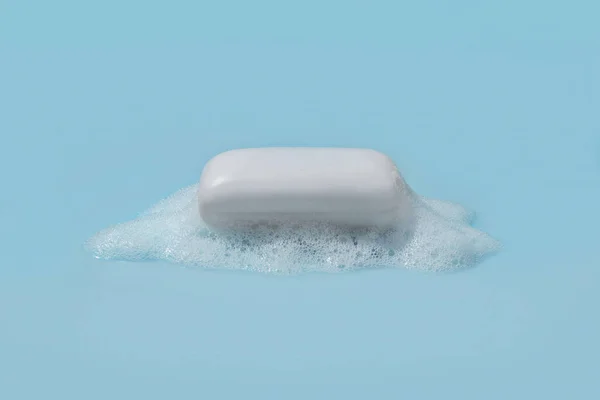 White Soap Bar Foam Center Blue Background — Stock Photo, Image