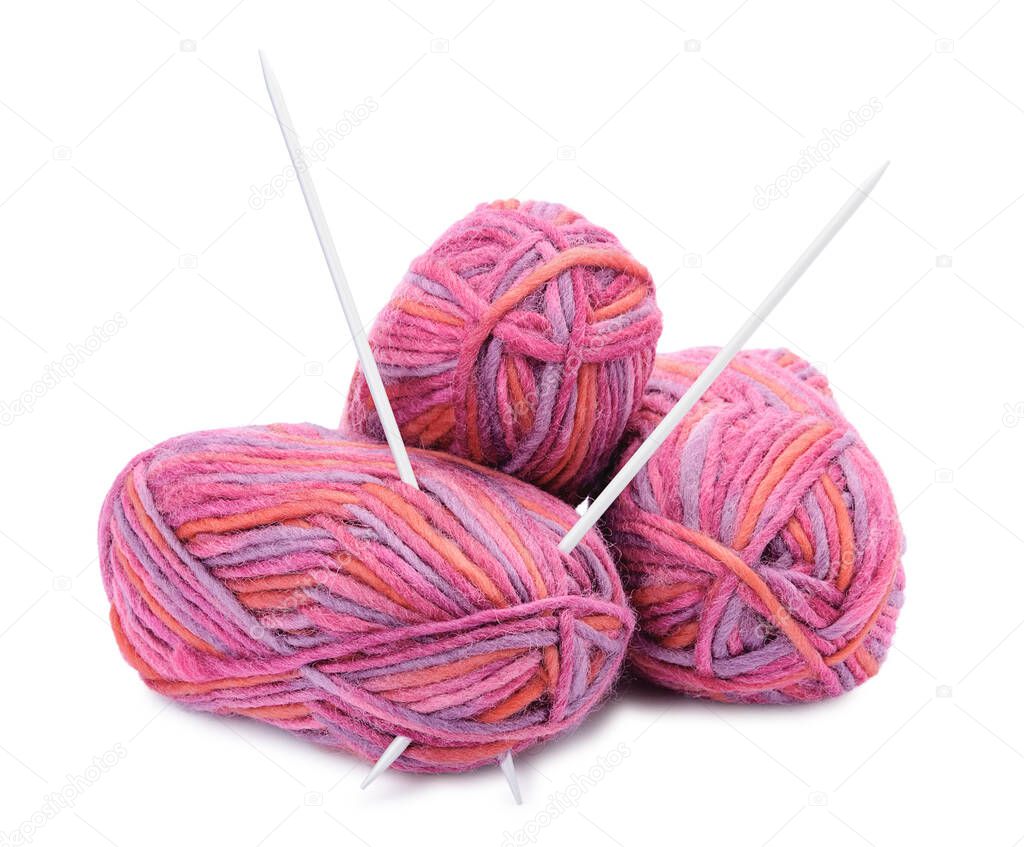 Group of hanks of colored yarns and knitting needles isolated on white background.