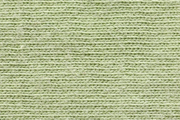 Texture of green cotton fabric, close-up.