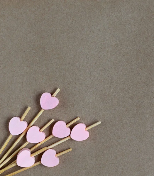 pink hearts on food skewers with place for text.