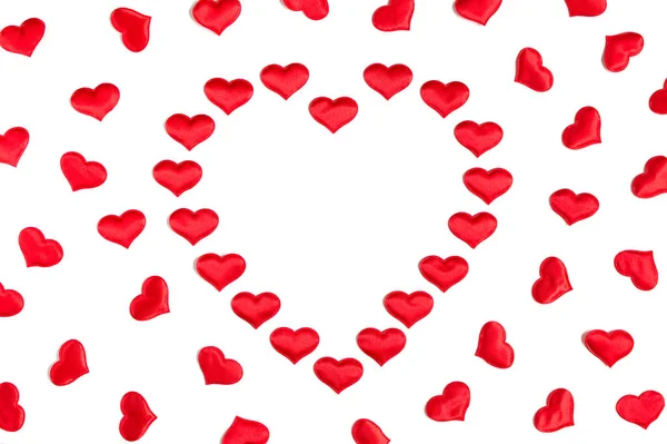 Corazón hecho de pequeños corazones rojos aislados sobre fondo blanco con espacio para copiar —  Fotos de Stock