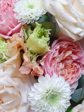 summer background of bouquet with rose bush, Ranunculus asiaticus.