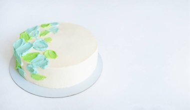 cake with green and blue abstract decor with copy space.