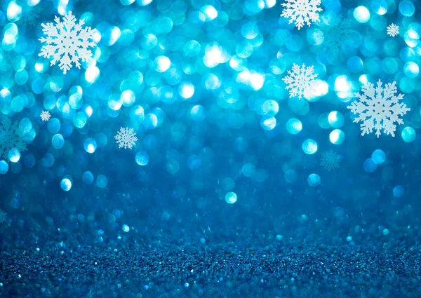 Natal e Ano Novo feriado fundo azul bokeh com flocos de neve — Fotografia de Stock