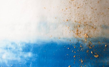 macro cream on the cake. background cake decor with blue and white cream with gold splashes