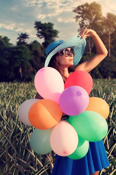 The girl with balloons. Vintage style — Stock Photo, Image