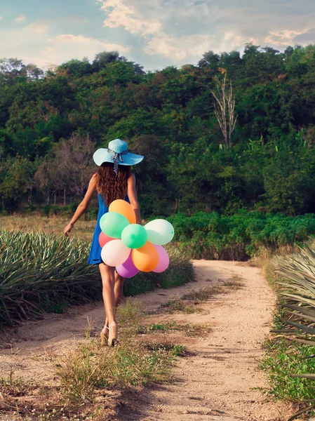 The girl with balloons. Vintage style — Stock Photo, Image