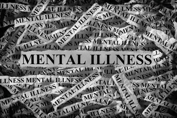 Mental illness. Torn pieces of paper with the words Mental illness. — Stock Photo, Image