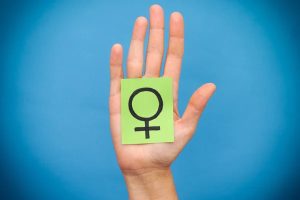 Green paper note with female gender symbol — Stock Photo, Image