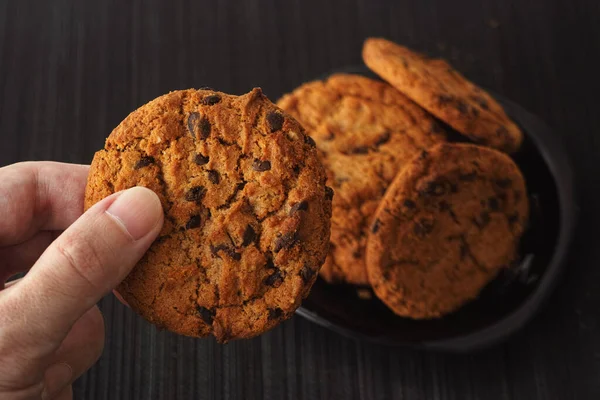 Man Holding Homemade Chocolate Chip Cookie His Hand Low Key — Stock Photo, Image