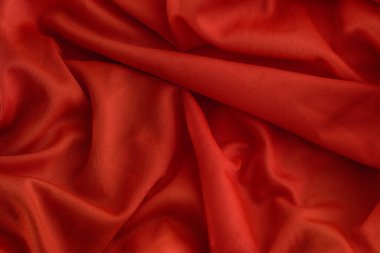 Kırmızı katlanmış kumaş dokusu arka planı. Kapat..