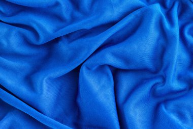 Mavi katlanmış kumaş dokusu arka planı. Kapat..