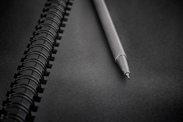 Black Spiral Notebook Ballpoint Pen Close Low Key — Stock Photo, Image
