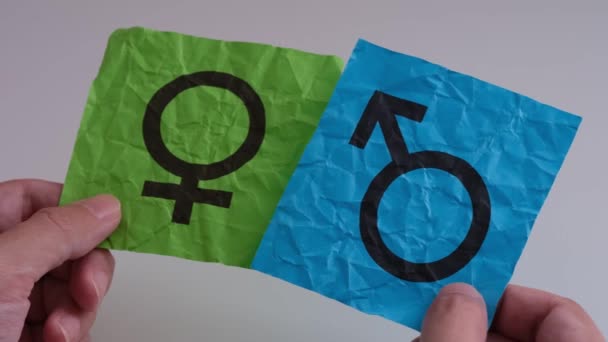 Person Holding Gender Symbols His Hands Close — Stock Video