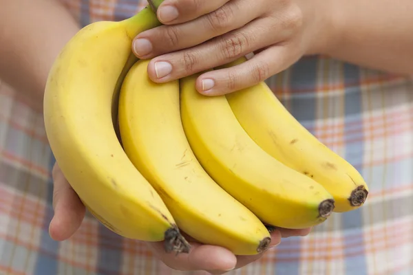 Bunch of organic banana in hands — Stock Photo, Image