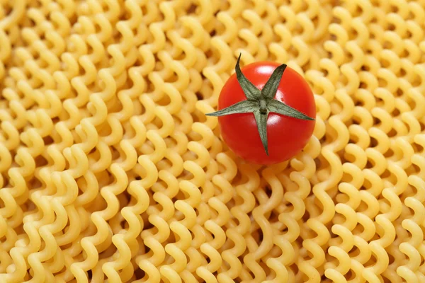 Pasta fusilli and cherry tomato — Stock Photo, Image