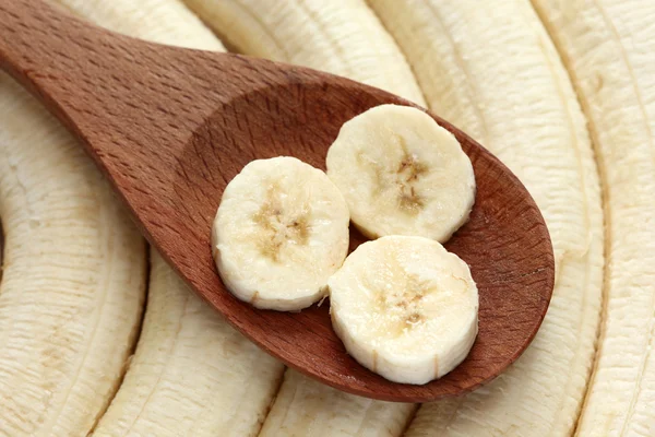 Bananas in a wooden spoon — Stock Photo, Image