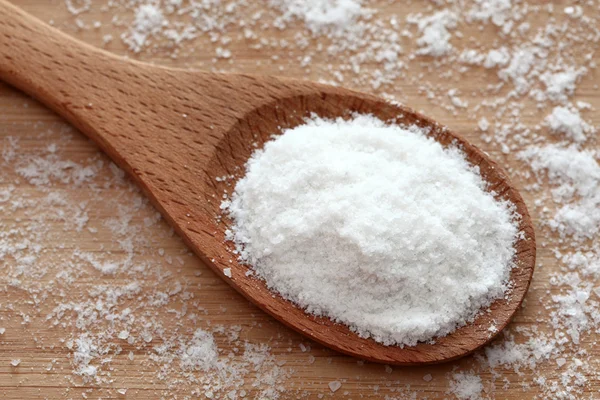 Salt in a wooden spoon — Stock Photo, Image